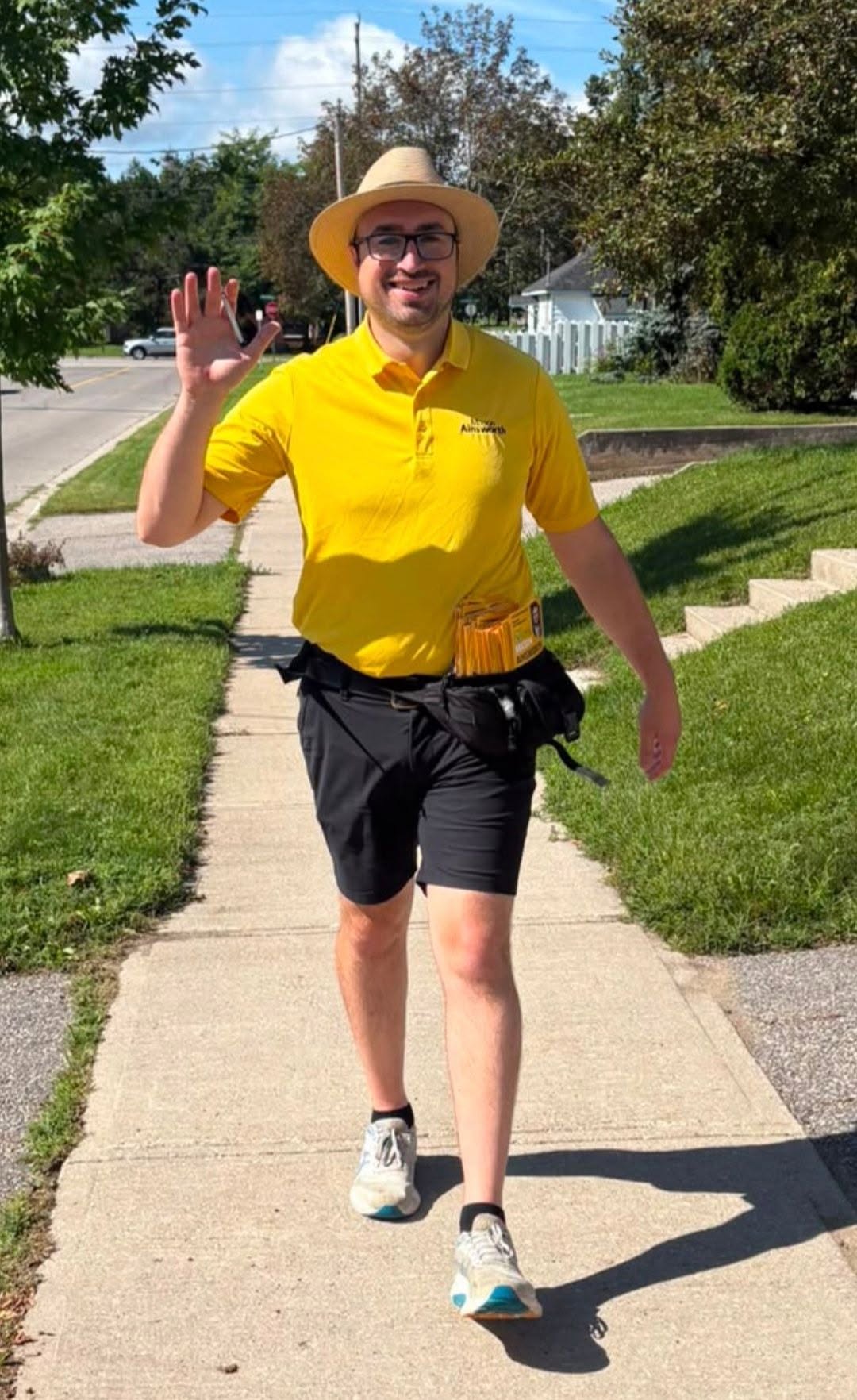 Mason Ainsworth waving while canvassing in Ward 2
